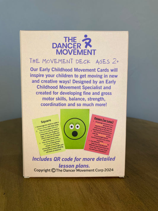 Box for 'The Dancer Movement' Early Childhood Movement Cards on a wooden surface with a gray background.